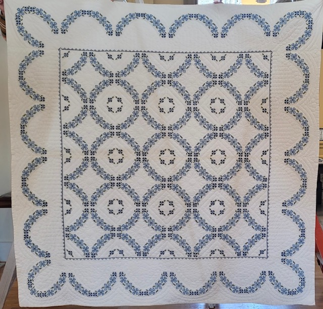 Paris Younger Women's Club quilt featuring blue and white pattern with circles and scallops.