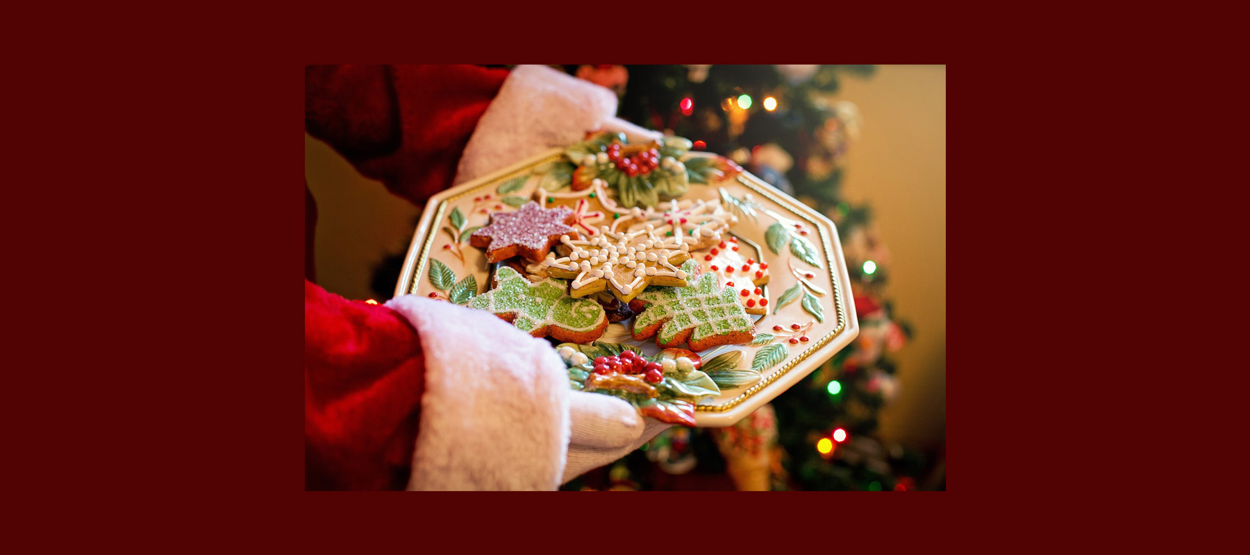 Santa's hands holding plate of cookies