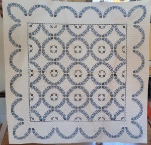 Paris Young Womens Club quilt featuring blue and white pattern with circles and scallops.